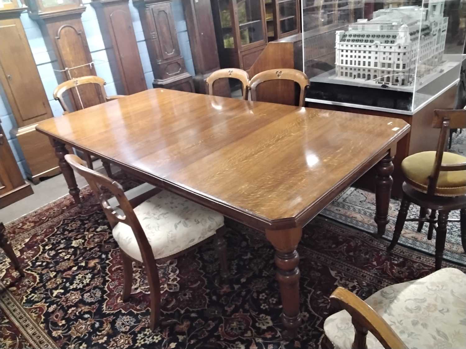 A late Victorian oak extending dining table with crank handle and two additional extension leaves, - Image 7 of 13