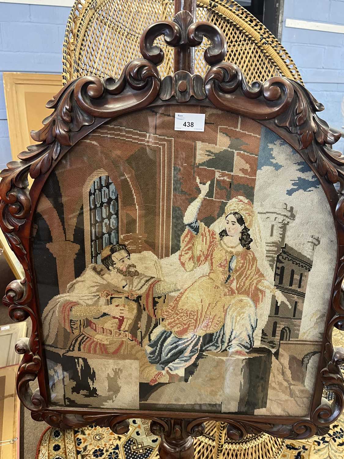 A Victorian mahogany framed pole screen, the panel decorated with a needlework classical scene, - Image 2 of 2