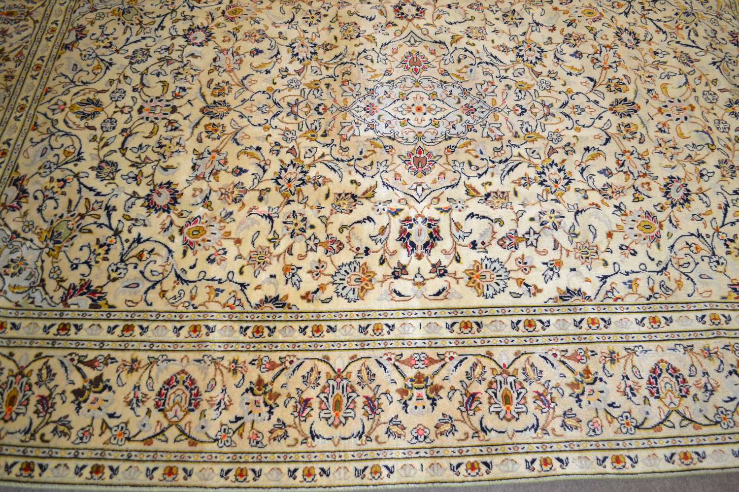 A modern Kashan carpet decorated with floral motifs on a pale background, 287 x 196cm - Image 2 of 2