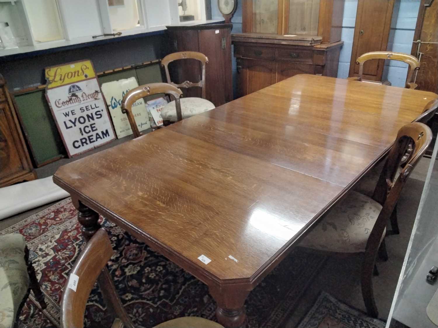 A late Victorian oak extending dining table with crank handle and two additional extension leaves, - Image 12 of 13