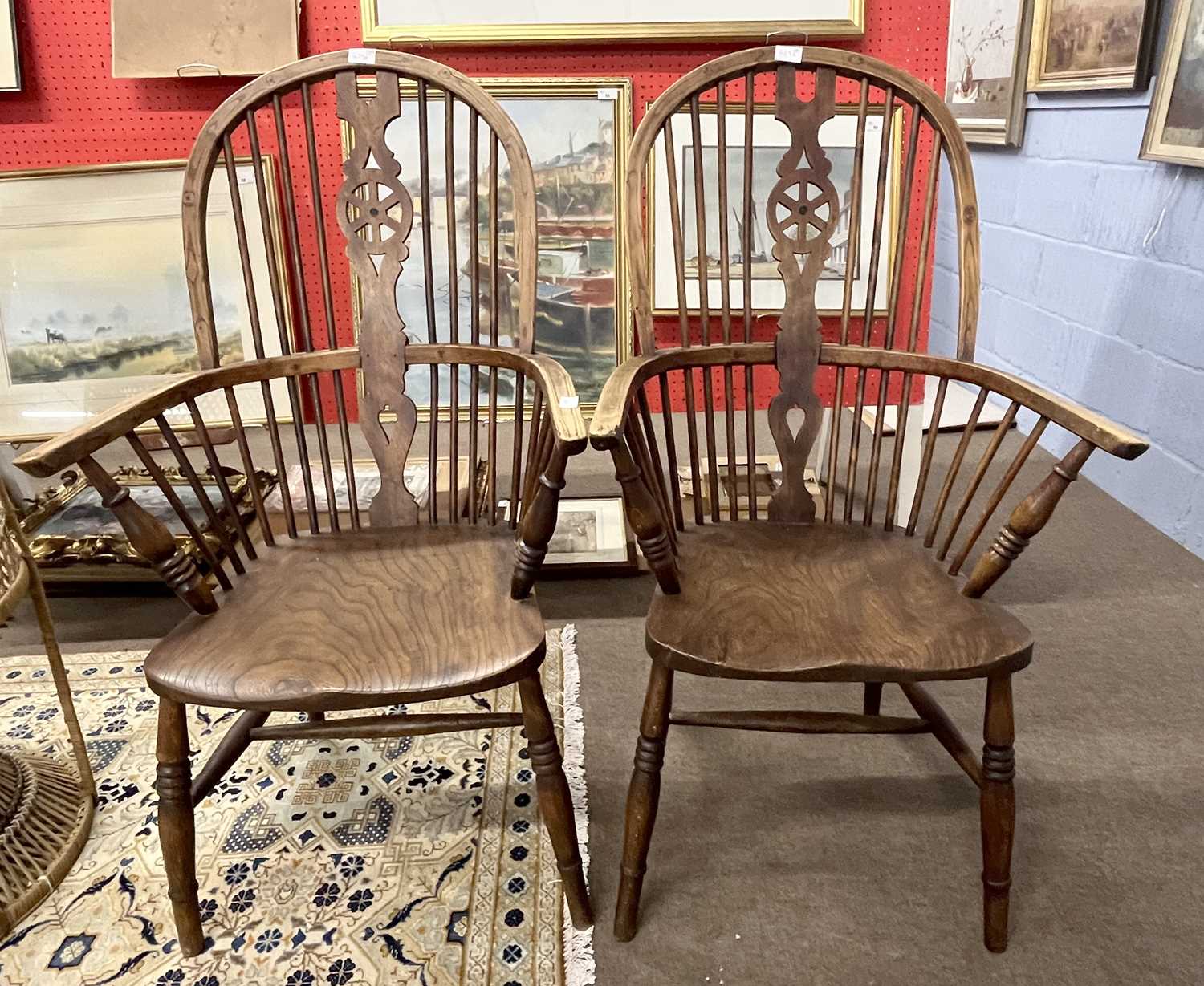 A pair of 19th Century Windsor wheel back armchairs with elm seats
