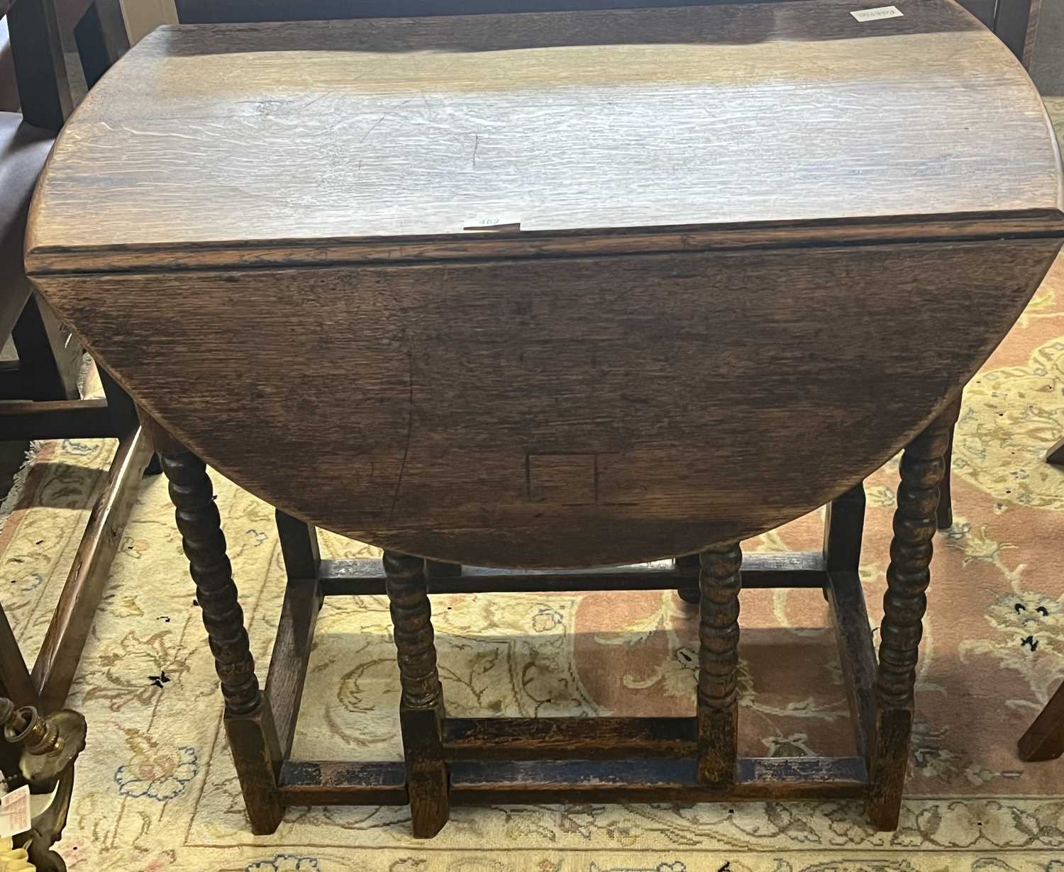 A small late 19th Century oak drop leaf table on bobbin turned legs, 73cm wide