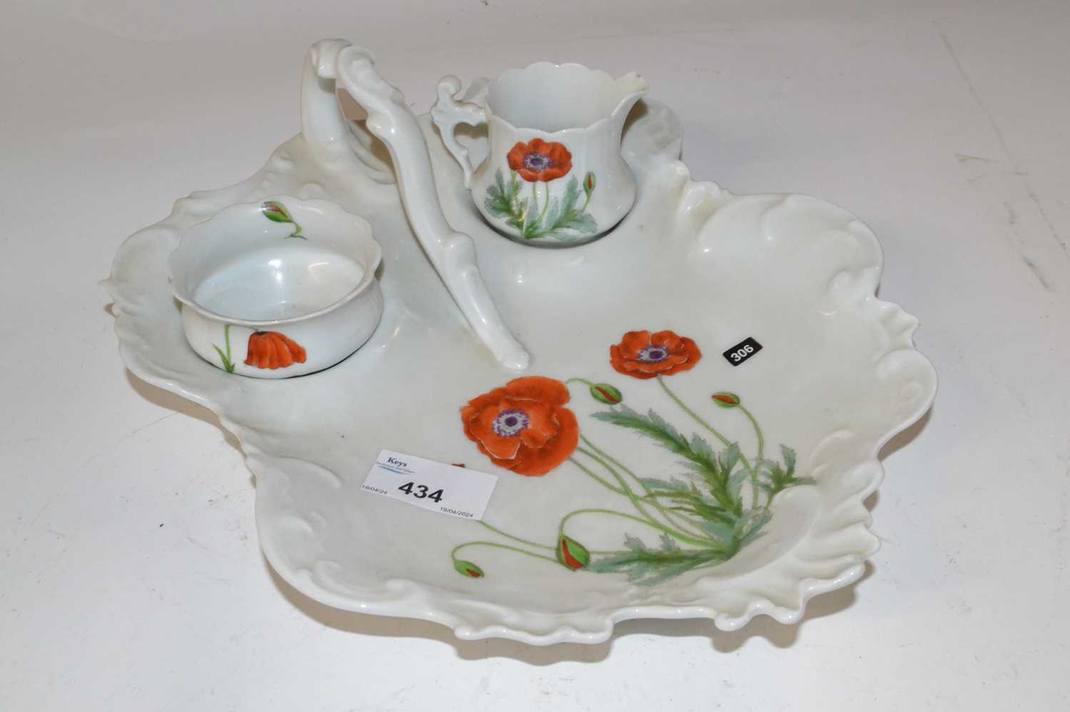 A Limoges porcelain dish with small bowl and jug, all painted with poppies (Inventory 306)