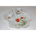 A Limoges porcelain dish with small bowl and jug, all painted with poppies (Inventory 306)