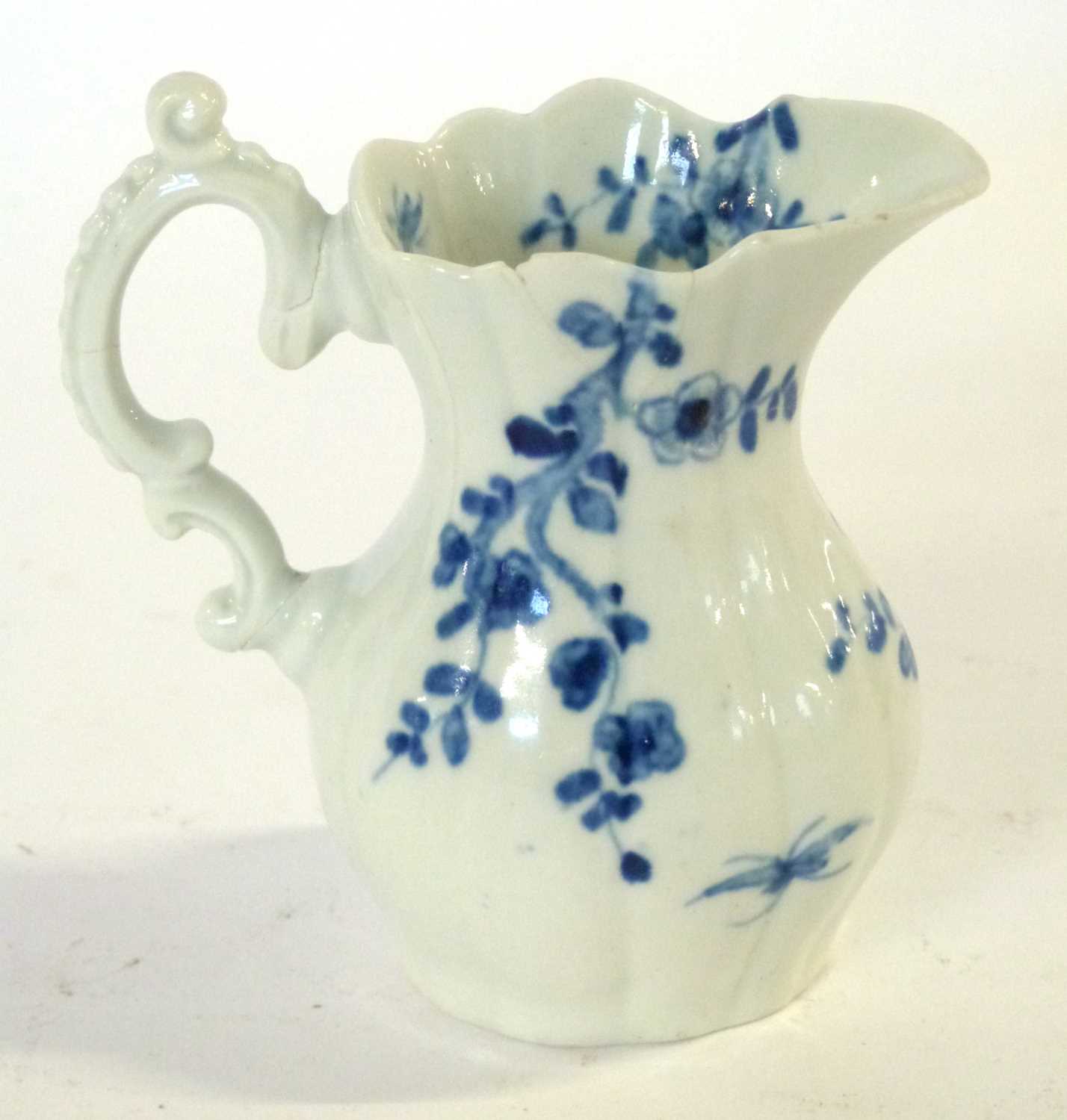 An early 18th Century Worcester porcelain jug in the root pattern with workmans mark to base