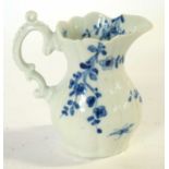 An early 18th Century Worcester porcelain jug in the root pattern with workmans mark to base