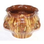 A Linthorpe Pottery jardiniere shape number 535 with a brown treacle design (one set of loop handles