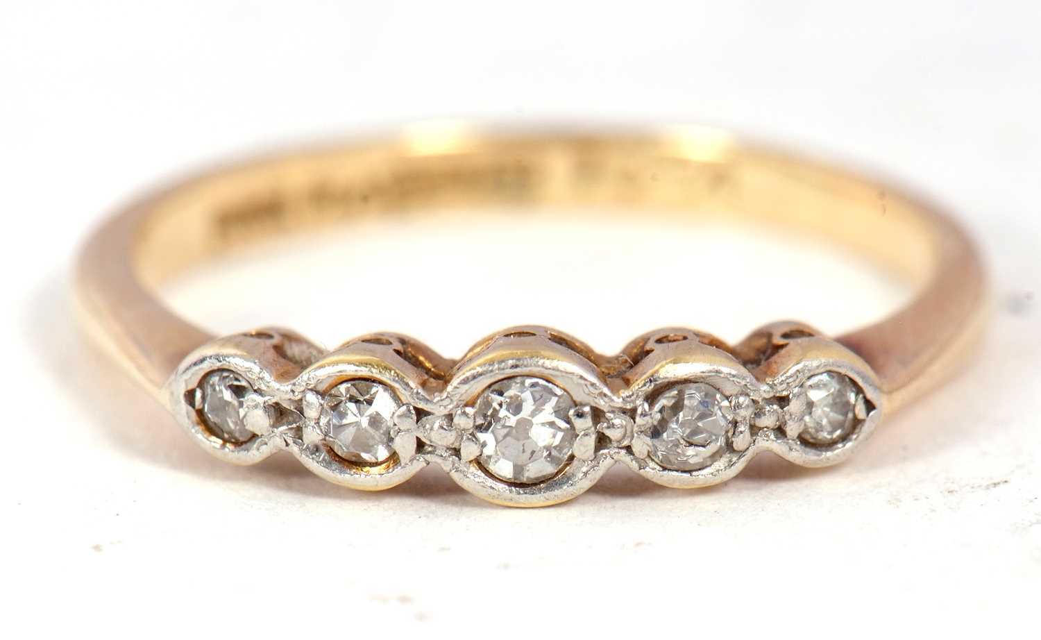 An 18ct gold and five diamond ring, circa 1920