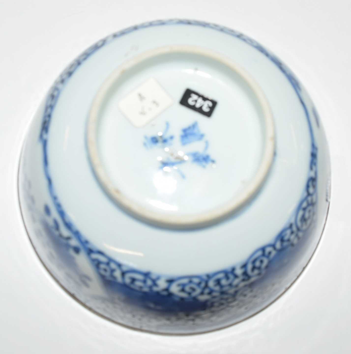 A Chinese porcelain bowl, 19th Century with blue and white floral design, four character mark to - Image 4 of 4
