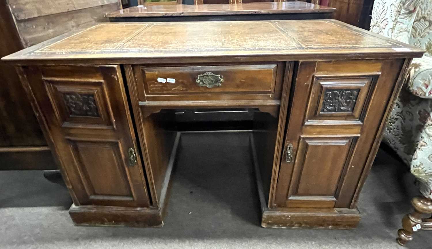 A late Victorian American walnut twin pedestal desk with brown leather inset top, 118cm wide