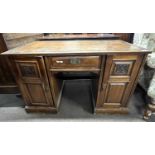 A late Victorian American walnut twin pedestal desk with brown leather inset top, 118cm wide