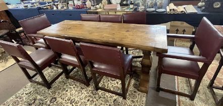 A good quality reproduction oak refectory dining table with think plank top, tapering end columns
