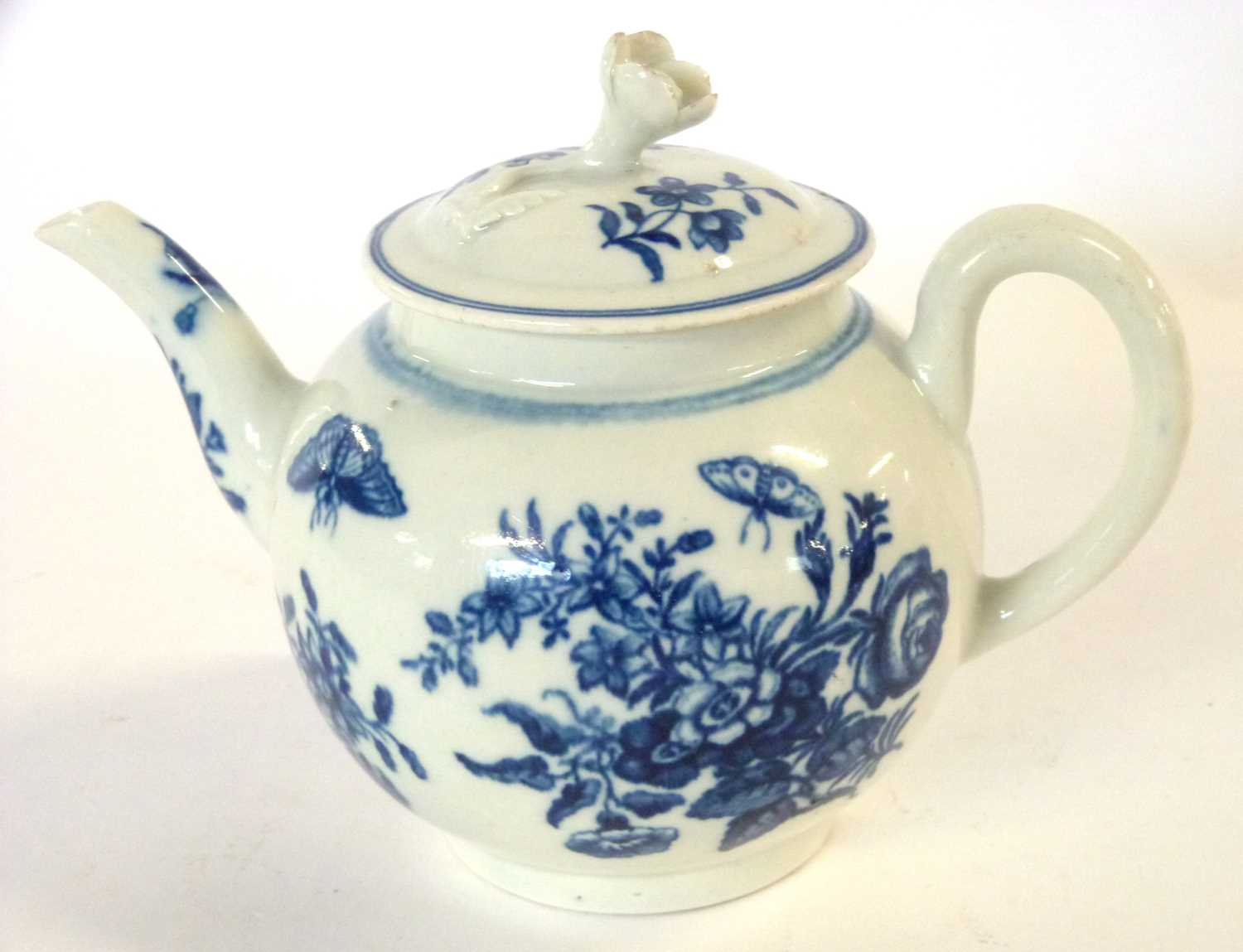 A Worcester porcelain teapot and cover, 18th Century with prints of flowers