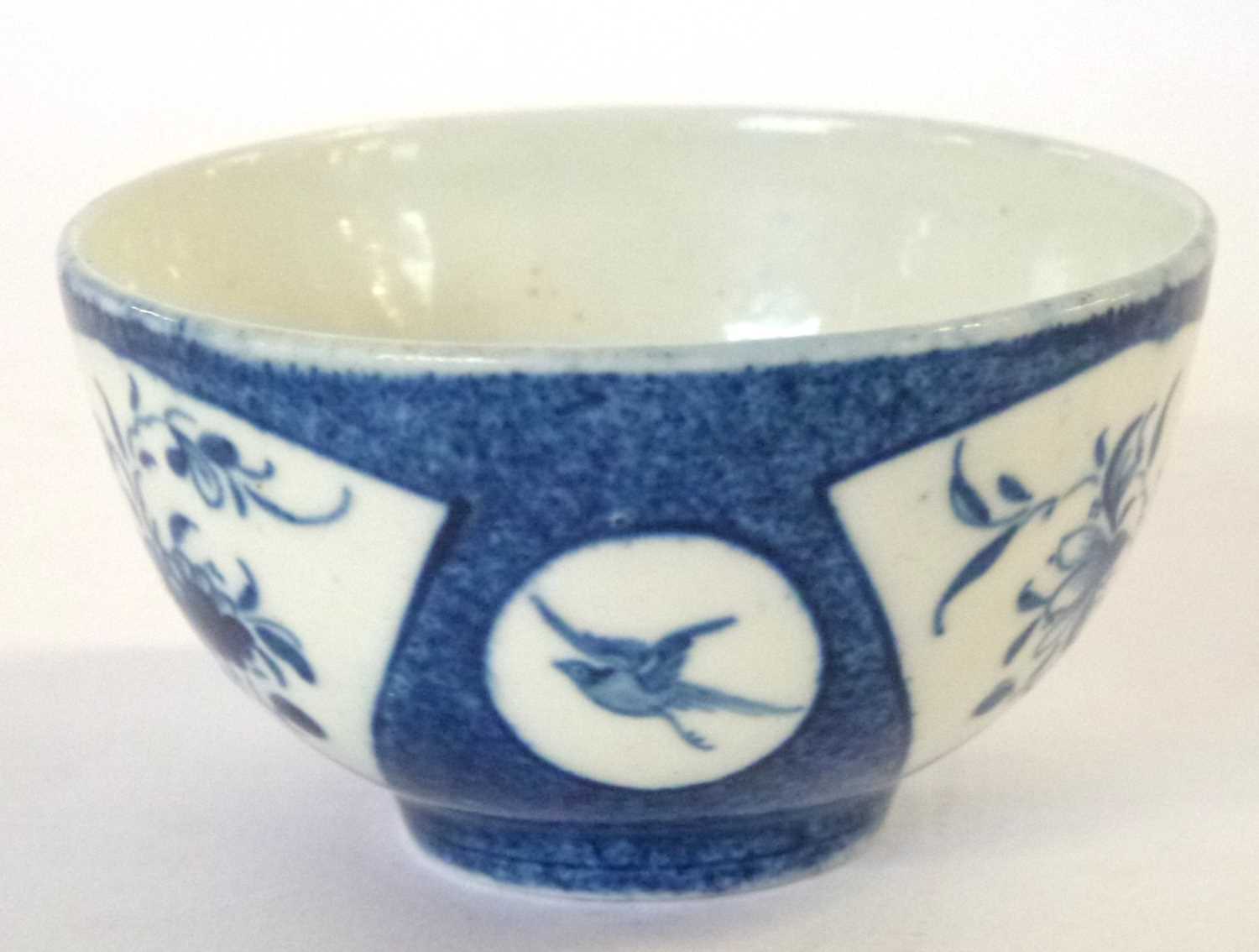A Worcester porcelain tea bowl, the blue ground with fan type reserve panels of flowers - Image 2 of 4