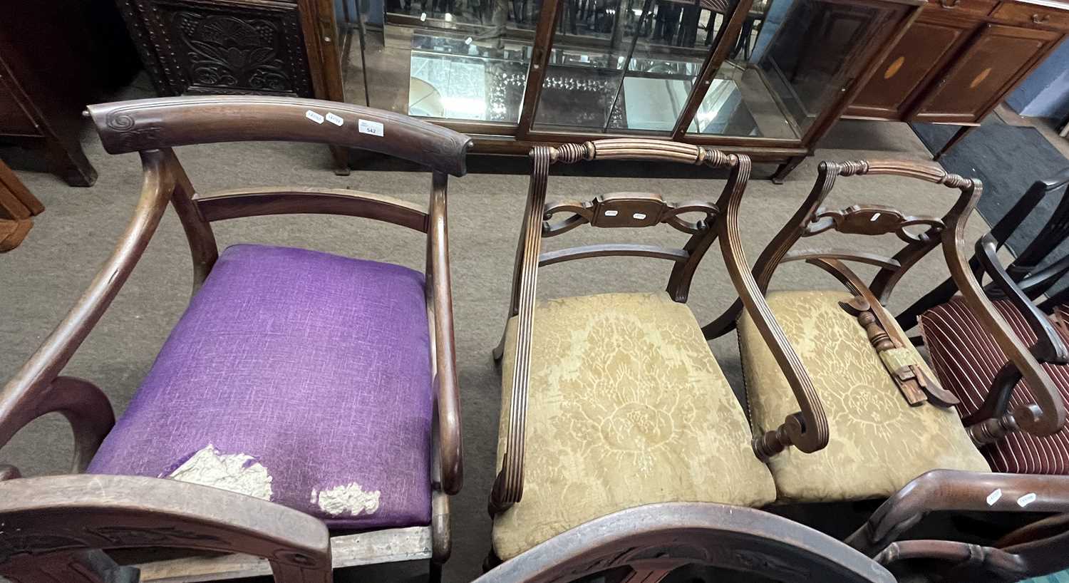 A pair of early 19th Century mahogany bar back carver chairs together with one other (3)