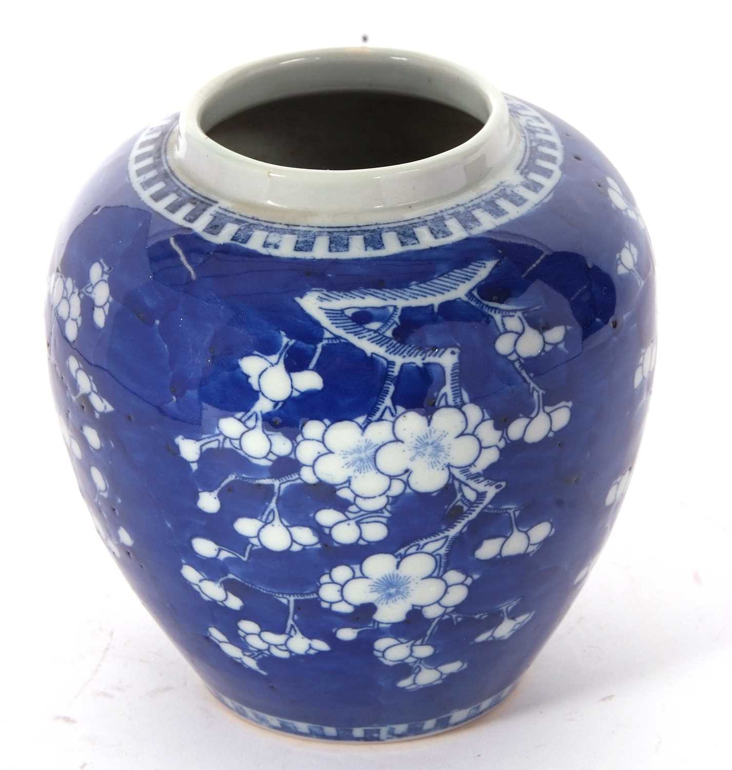 Chinese porcelain ginger jar 19th Century decorated with prunus on a blue ground - Image 4 of 14