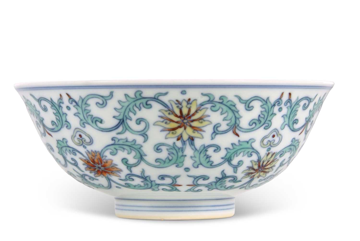 A Chinese Wucai bowl with flowerheads amongst scrolling foliage Apocryphal Qianlong mark to base