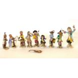 Collection of continental porcelain monkey band figures after Meissen including a conductor and