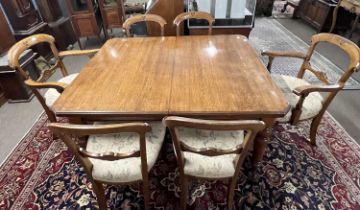 A late Victorian oak extending dining table with crank handle and two additional extension leaves,
