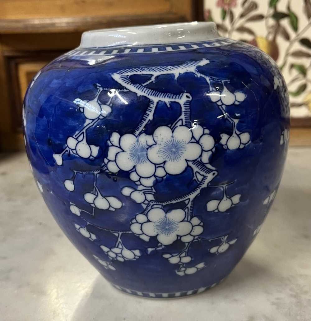 A Chinese porcelain ginger jar 19th Century, the blue ground with prunus decoration, four - Image 5 of 11