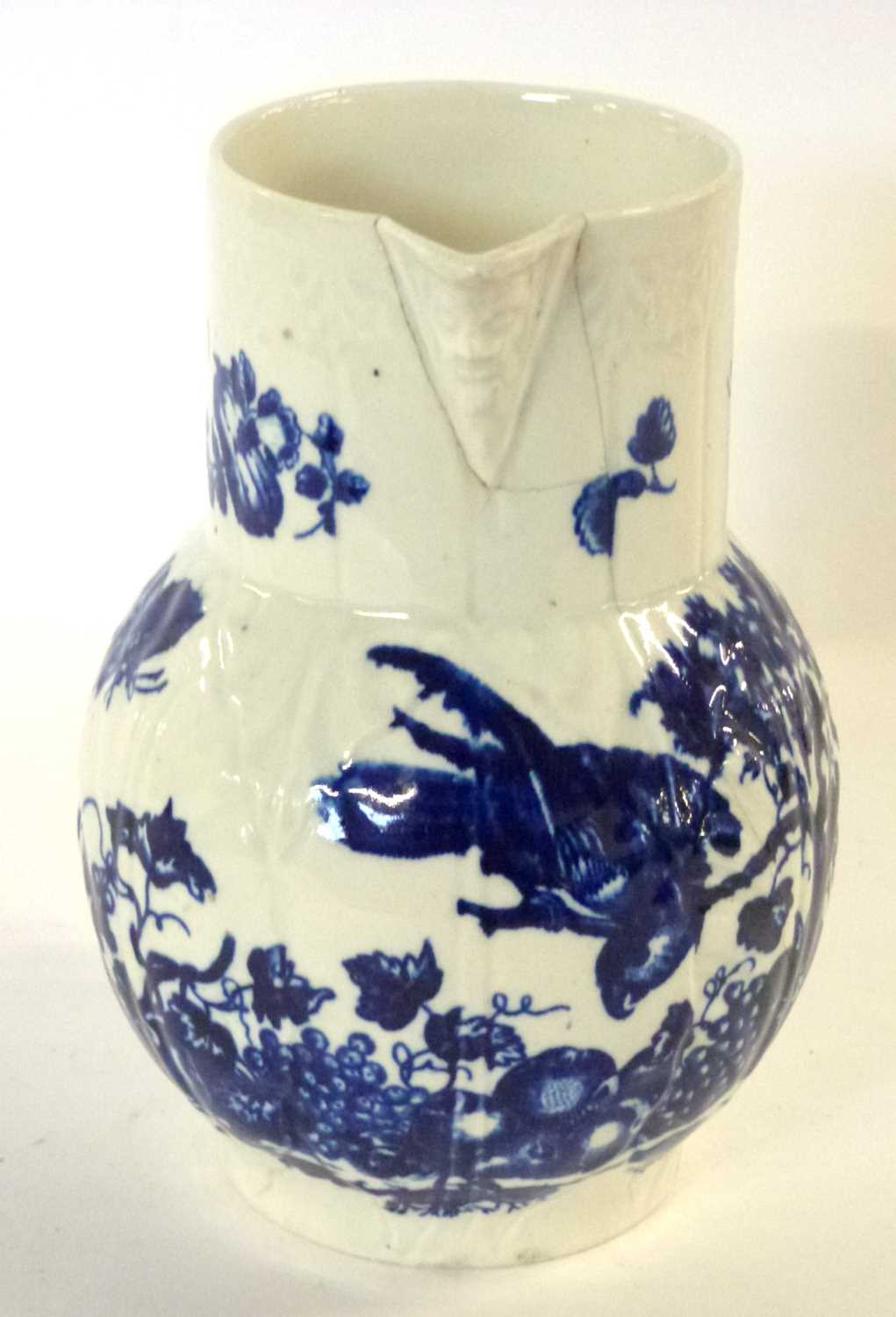 A Worcester porcelain mask jug decorated with prints of the parrot pecking fruit, 17cm high ( - Image 5 of 6