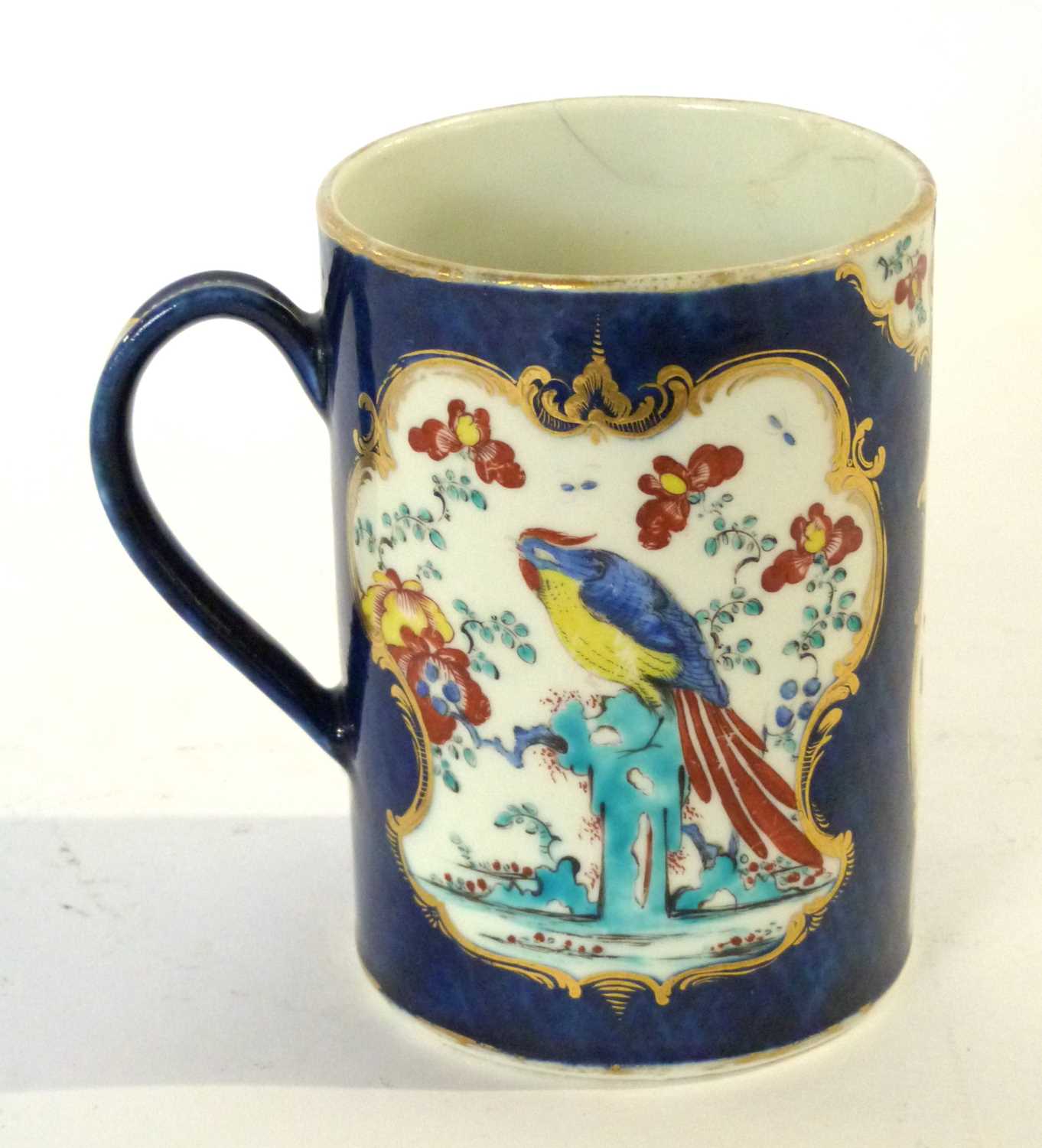 An 18th Century Worcester mug, the blue ground with the Sir Joshua Reynolds polychrome pattern, 12cm