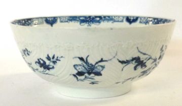An 18th Century Worcester porcelain punch bowl the moulded body painted in blue with the rare