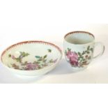 An 18th Century lustre porcelain cup and saucer decorated in Curtis style with flowers (chip to