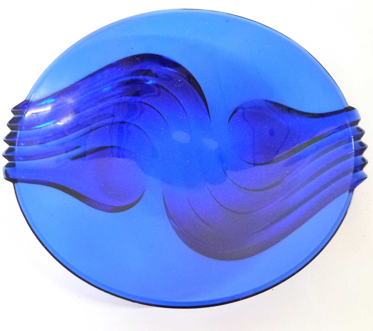 A large blue glass Art Deco style bowl together with a carved wooden model of a crocodile