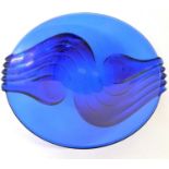 A large blue glass Art Deco style bowl together with a carved wooden model of a crocodile