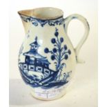 A Lowestoft porcelain sparrow beak jug with blue and white decoration of a begoda, 9cm high
