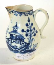 A Lowestoft porcelain sparrow beak jug with blue and white decoration of a begoda, 9cm high