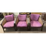 A set of three early 20th Century bergere bow back tub chairs with sprung seats