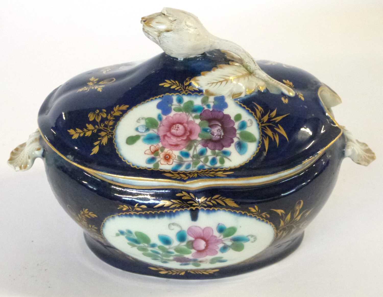 A Worcester porcelain small dessert tureen and cover, the gros bleu ground with panels of floral
