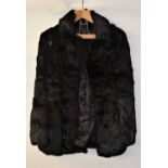 A lady's black rabbit fur jacket