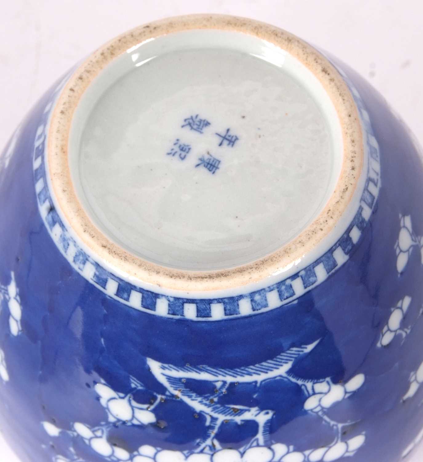 Chinese porcelain ginger jar 19th Century decorated with prunus on a blue ground - Image 5 of 14