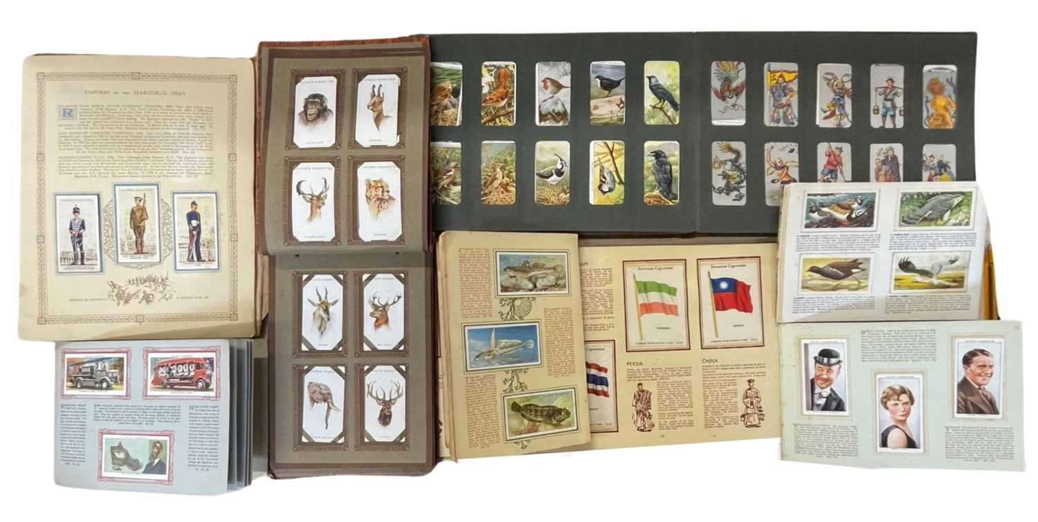 A mixed lot of various 20th cigarette card albums, to include wildlife, military, radio stars,