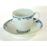 A Worcester porcelain cup and saucer, the ribbed body with a blue and white design to border