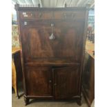 Early 19th Century French mahogany and brass inlaid secretaire cabinet with two drawers over a