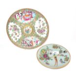 A 19th Century Cantonese dish decorated in famille rose style together with a further smaller