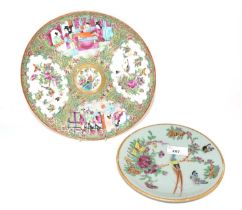 A 19th Century Cantonese dish decorated in famille rose style together with a further smaller