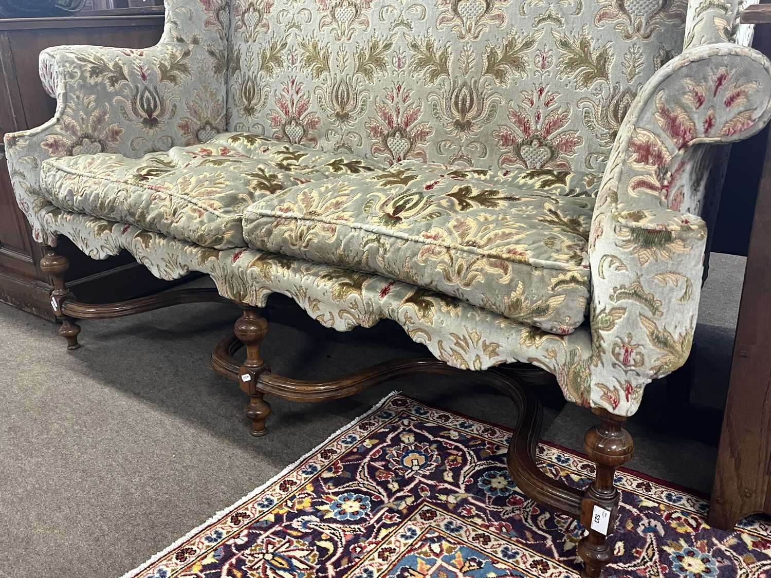 A Carolean style wing back sofa with floral upholstery and turned legs united by two X formed - Image 3 of 6