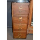 An early 20th Century oak four drawer filing chest with brass handles, 130cm high