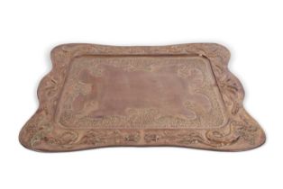 A large Arts & Crafts copper serving tray, decorated with a border of dragons and foliate detail, 56