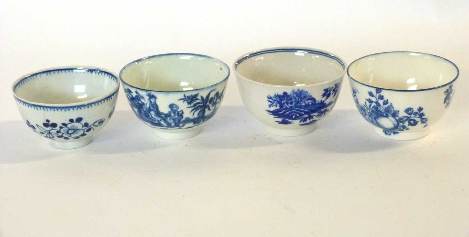 A group of four English porcelain tea bowls including a Liverpool example and Worcester examples