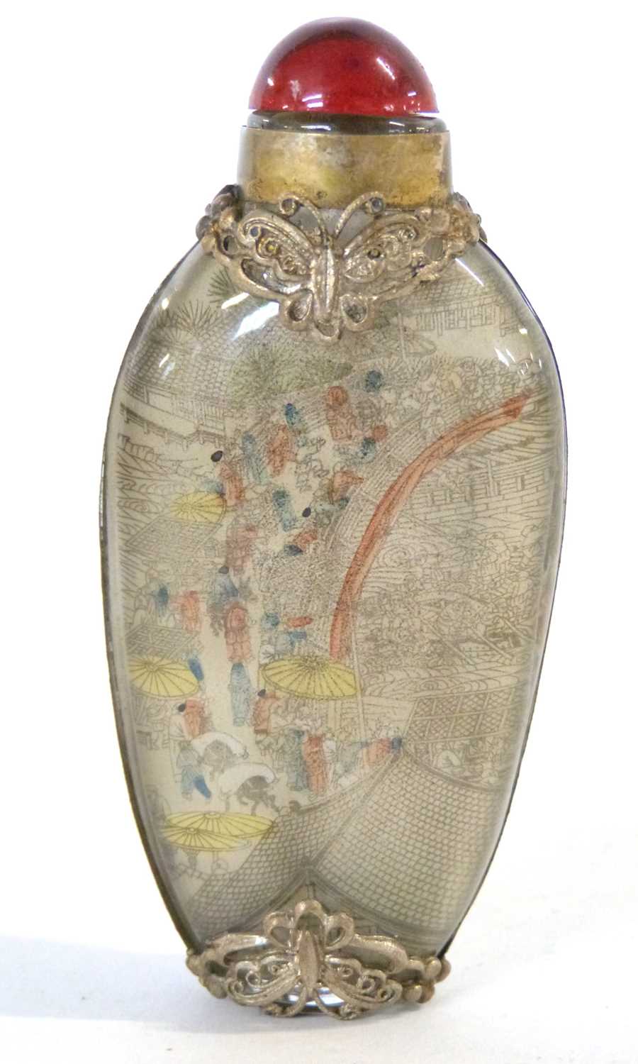 Antique Chinese reverse-painted snuff bottle with hardstone stopper and decorated with intricate