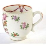 An 18th Century Lowestoft porcelain coffee cup with a polychrome Curtis style design