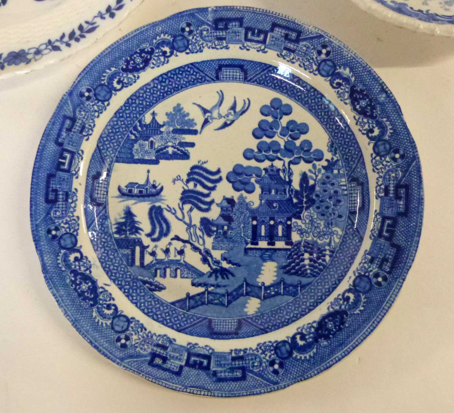 A group of Staffordshire wares including a Chinese marine scene, a Minton blue and white plate and - Image 4 of 5