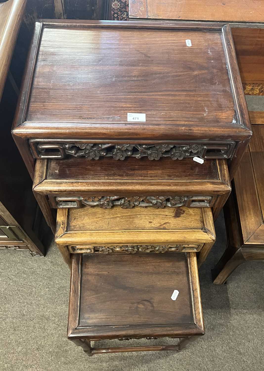 A nest of four Chinese hardwood tables with pierced floral decoration, largest 50cm wide - Image 3 of 4