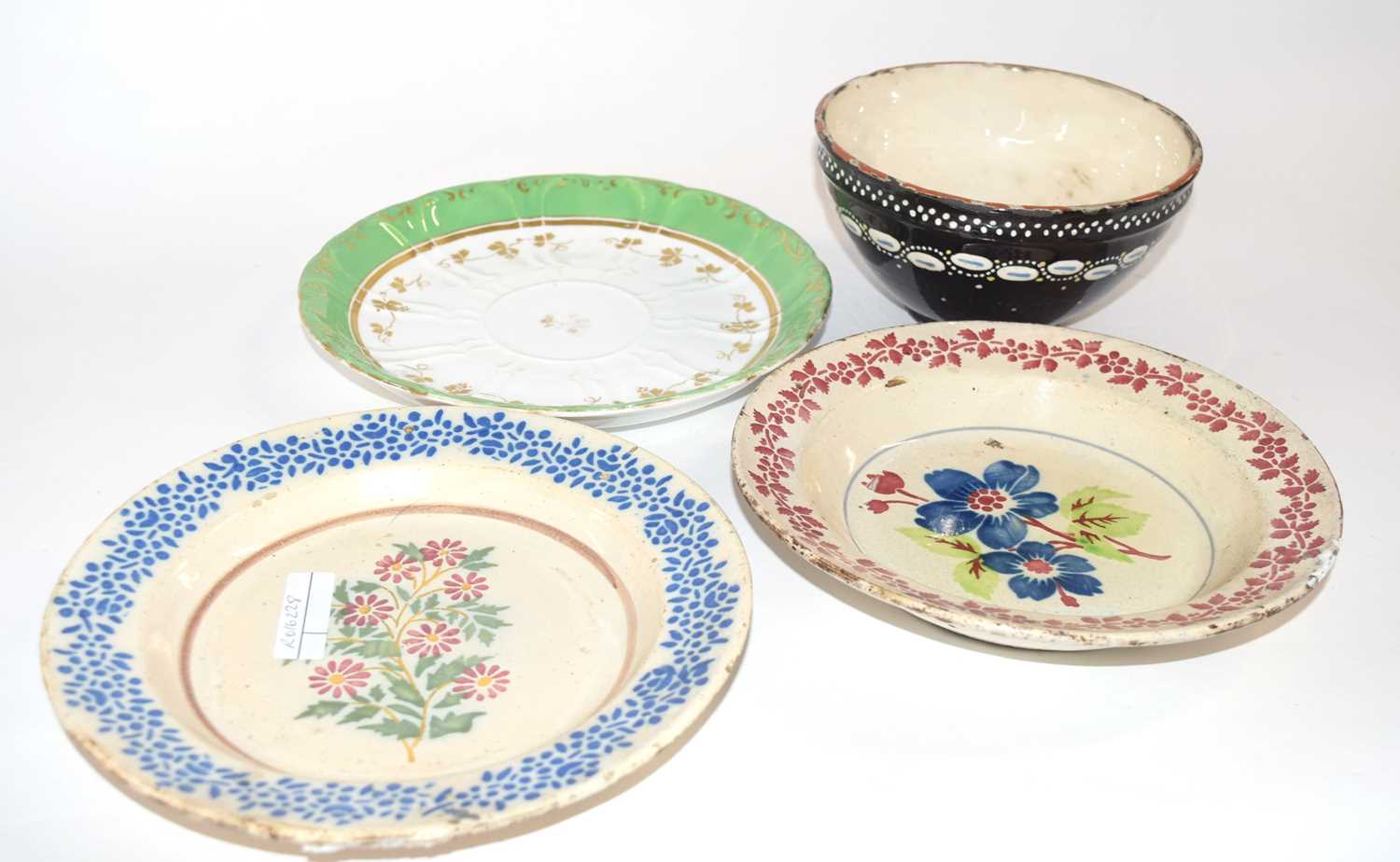 Quantity of 18th Century Dutch Delft plates together with a slip ware decorated bowl, the plates